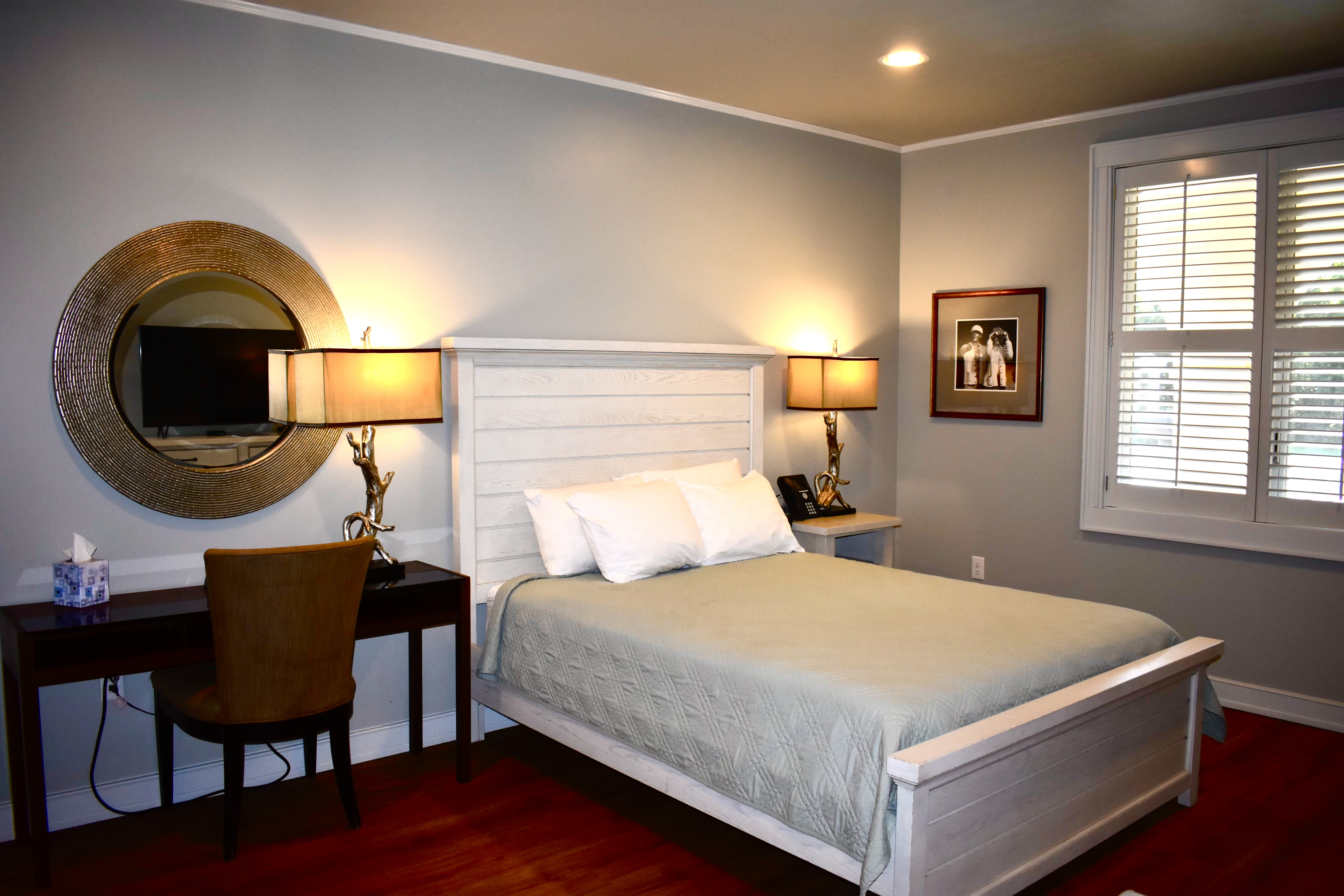 Peaceful Fisher House guest bedroom bathed in soft daylight